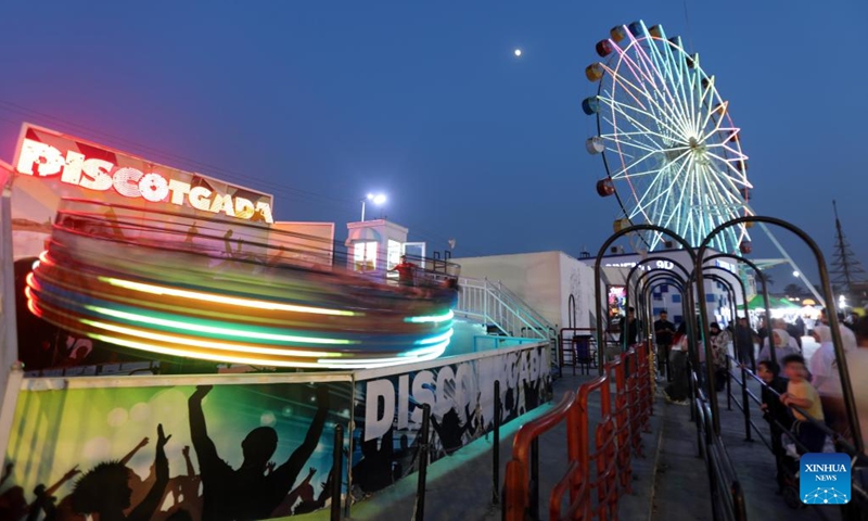 People visit an amusement park during Eid al-Adha in Baghdad, Iraq, on June 7, 2025. (Photo: Xinhua)