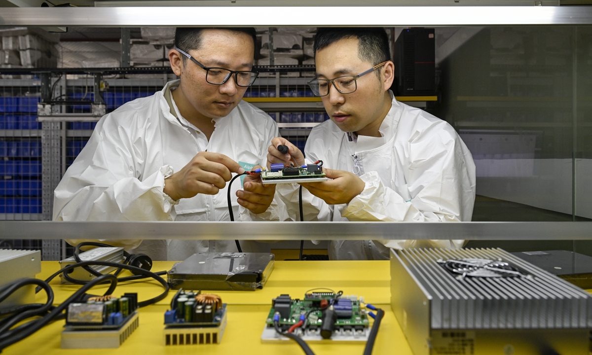 Technicians configure parameters for the sensors of an intelligent inspection robot on May 20, 2025, in the Luyang Economic Development Zone of Hefei, East China's Anhui Province. Amid the nation's efforts to develop new quality productive forces, the zone has focused on developing the intelligent sensing industry, continuously expanding its scale and accelerating efforts to build Hefei into a leading hub for smart sensor innovation. Photo: VCG

