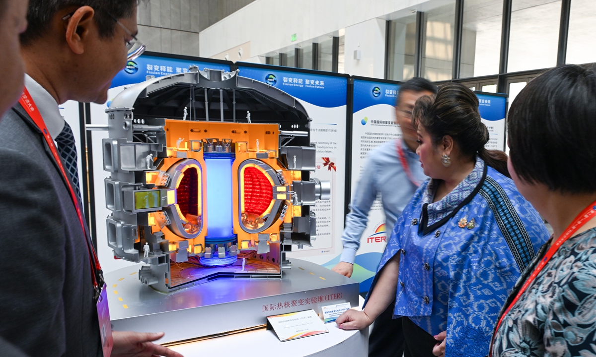 Foreign visitors look at the International Thermonuclear Experimental Reactor (ITER) model displayed at the Second Belt and Road Conference on Science and Technology Exchange in Chengdu, Southwest China's Sichuan Province, on June 12, 2025. The same day, a roundtable discussion on civil nuclear energy technology and energy industry development was held, attracting representatives from government agencies, renowned international organizations, universities, research institutions, leading industry enterprises, and academic associations. Photo: VCG