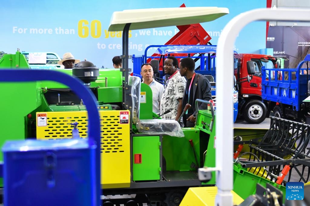 Visitors learn about an agricultural machine during the fourth China-Africa Economic and Trade Expo at Changsha International Convention and Exhibition Center in Changsha, central China's Hunan Province, June 14, 2025. The fourth China-Africa Economic and Trade Expo opened Thursday in the central Chinese city of Changsha, highlighting the commitment of the world's largest developing country to strengthening ties with Africa, the continent with the largest number of developing nations. (Photo: Xinhua)