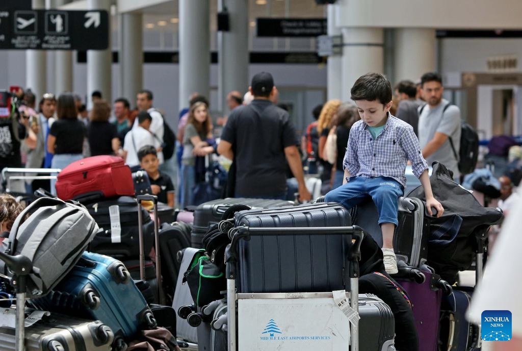 Travelers wait for their flights at an airport in Beirut, Lebanon, on June 14, 2025. Lebanese Minister of Public Works and Transport Fayez Rasamny announced on Saturday the reopening of Beirut Airport, which had been closed since 10 p.m. (1900 GMT) the previous day amid escalating regional tensions following the exchange of strikes between Israel and Iran. The state-run National News Agency (NNA) reported congestion in the airport's departure hall as operations resumed, with authorities working to ease crowding and restore order. (Photo: Xinhua)
