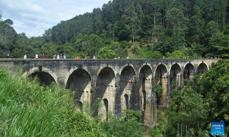 This photo taken on June 13, 2025 shows people visiting a nine-arch railway bridge built during the colonial era, in Ella, Sri Lanka. (Photo: Xinhua)