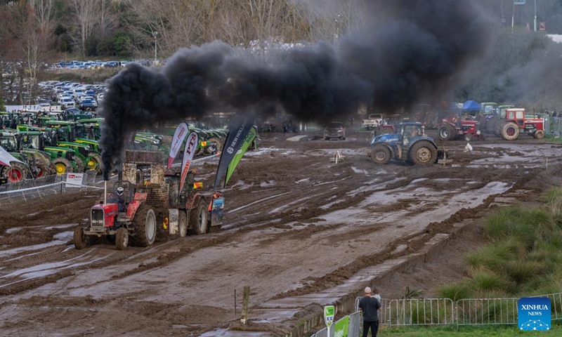 This photo taken on June 14, 2025 shows a scene of a tractor competition held at the 57th Fieldays in Hamilton, New Zealand. The 57th Fieldays, the Southern Hemisphere's largest agricultural event, concluded here on Saturday. This year's event, which began on Wednesday, has seen a record number of exhibitors, highlighting advancements in agritech, sustainability, and rural wellbeing. (Photo: Xinhua)