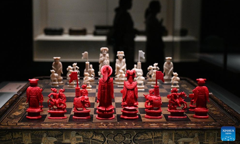 This photo taken on June 12, 2025 shows a carved ivory chess set displayed at the China (Hainan) Museum of the South China Sea in Qionghai, south China's Hainan Province. A great number of exhibits relevant to the Maritime Silk Road are showcased at the China (Hainan) Museum of the South China Sea, providing valuable insights into the prosperity of the Maritime Silk Road in ancient China and the exchanges between Chinese and foreign civilizations. (Photo: Xinhua)