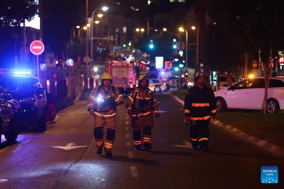 Emergency response personnel arrive at a site hit by missiles fired from Iran in central Israel, on June 13, 2025. Three Israelis were killed and 172 others injured in rocket barrages launched from Iran on Friday night and early Saturday morning, according to Israel's state-owned Kan TV News. According to the Israeli army, Iran launched hundreds of missiles in five barrages during the assaults. (Photo: Xinhua)