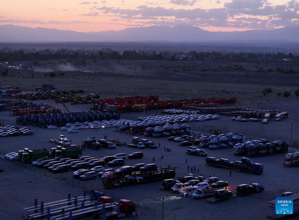 An aerial drone photo taken at dusk on May 22, 2025 shows a transit parking lot in the town of Zharkent, Kazakhstan. (Photo: Xinhua)