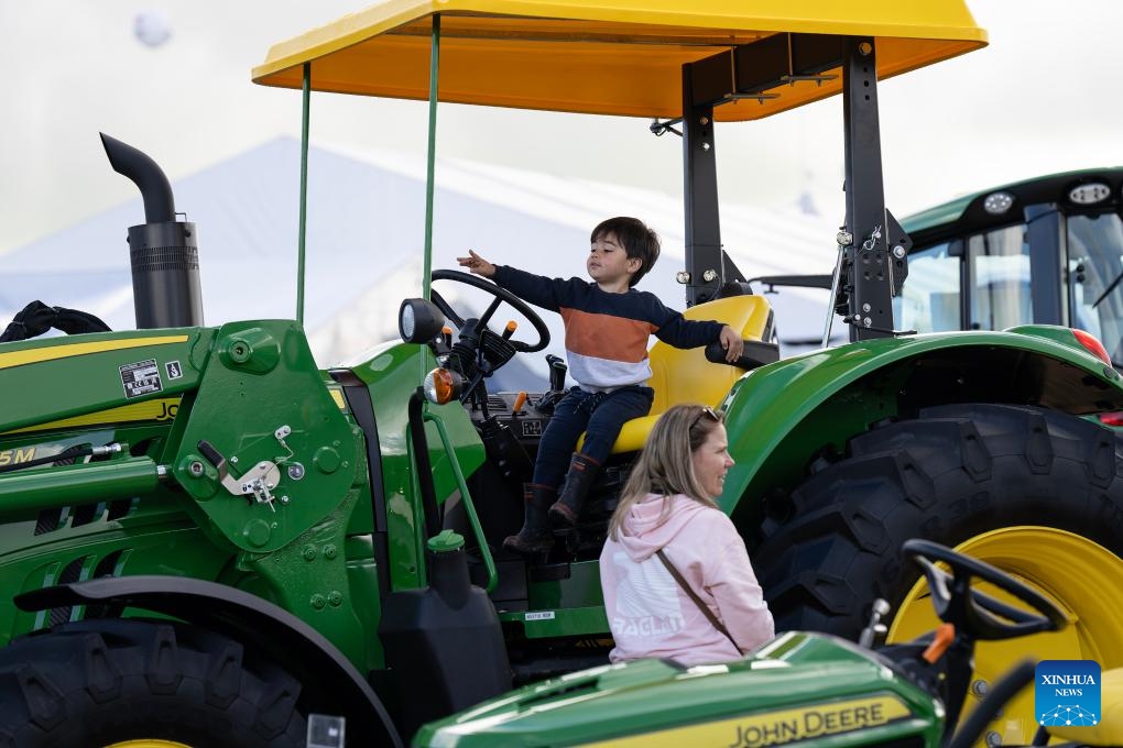A boy sits on a tractor at the 57th Fieldays in Hamilton, New Zealand, June 14, 2025. The 57th Fieldays, the Southern Hemisphere's largest agricultural event, concluded here on Saturday. This year's event, which began on Wednesday, has seen a record number of exhibitors, highlighting advancements in agritech, sustainability, and rural wellbeing. (Photo: Xinhua)
