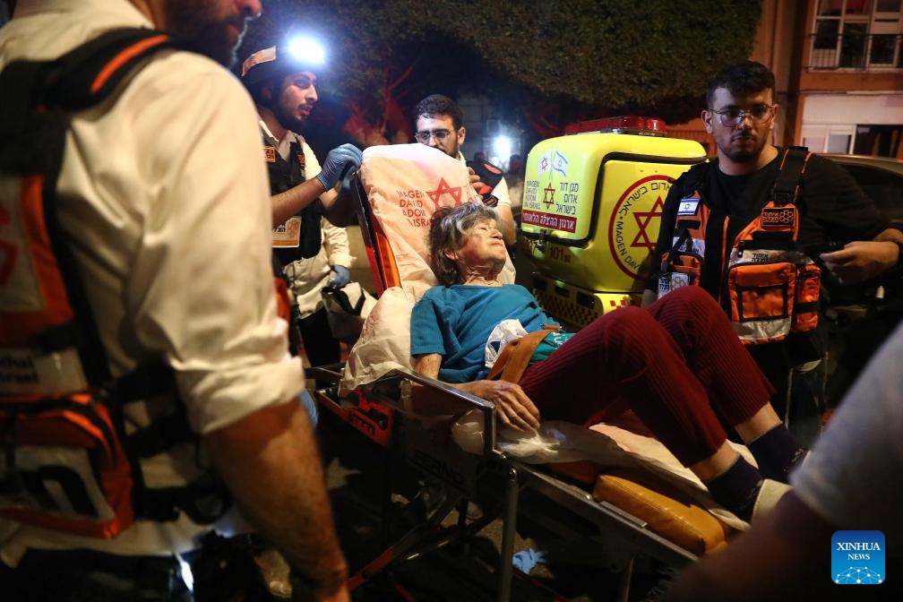 Rescuers transport a person injured in Iranian missile strikes in Bat Yam, south of Tel Aviv, Israel, June 15, 2025. Iranian aerial attacks killed at least six people and injured 140 others in Israel early on Sunday, Israeli authorities said. (Photo: Xinhua)