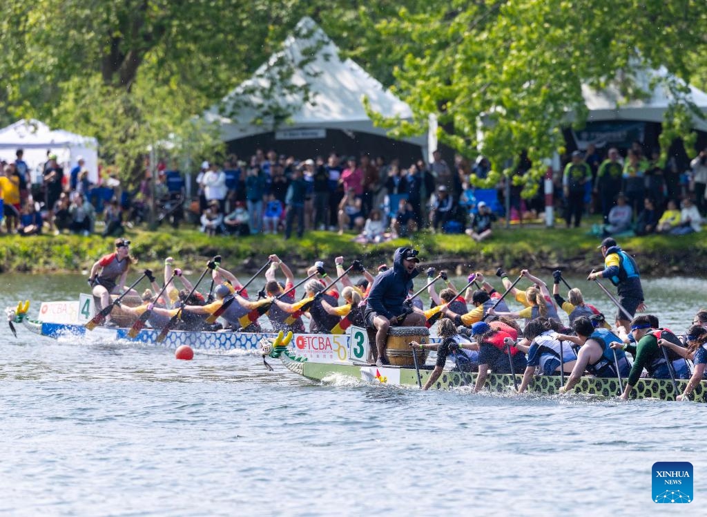 Participants compete during the 2025 Toronto International Dragon Boat Race Festival in Toronto, Canada, on June 14, 2025. (Photo: Xinhua)