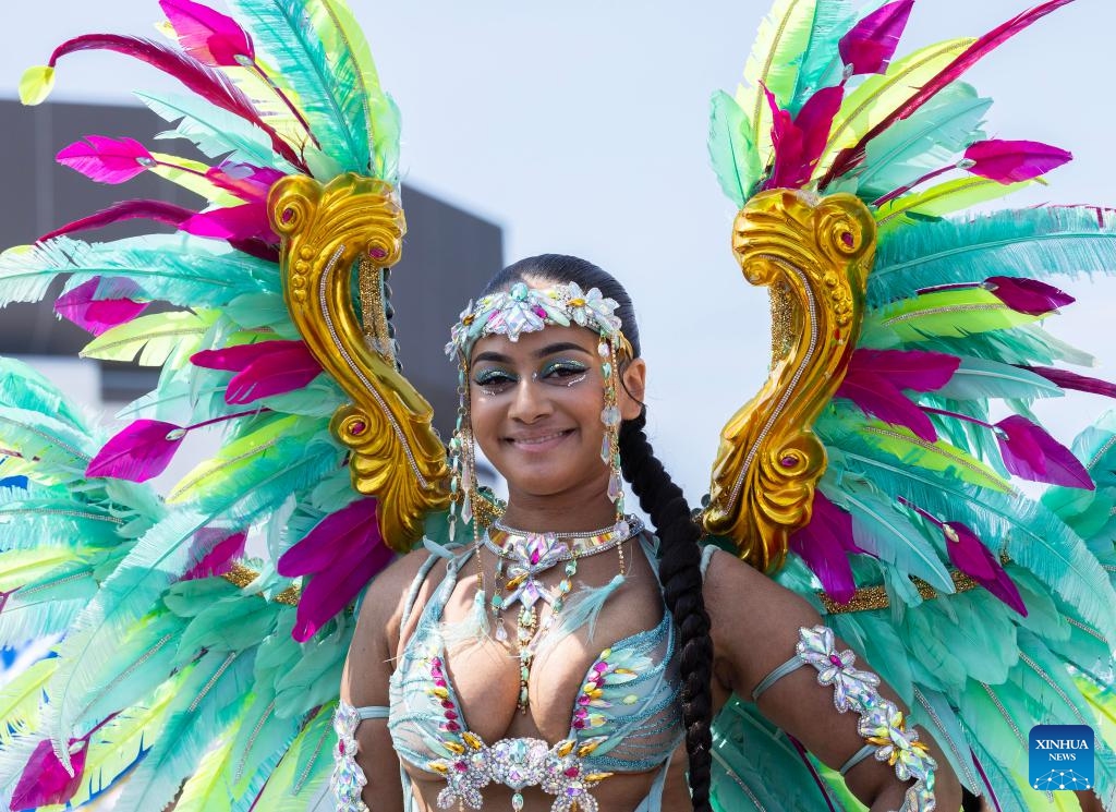 A dressed-up reveler poses for photos during the official launch ceremony of the 2025 Toronto Caribbean Carnival in Toronto, Canada, on June 14, 2025. (Photo: Xinhua)