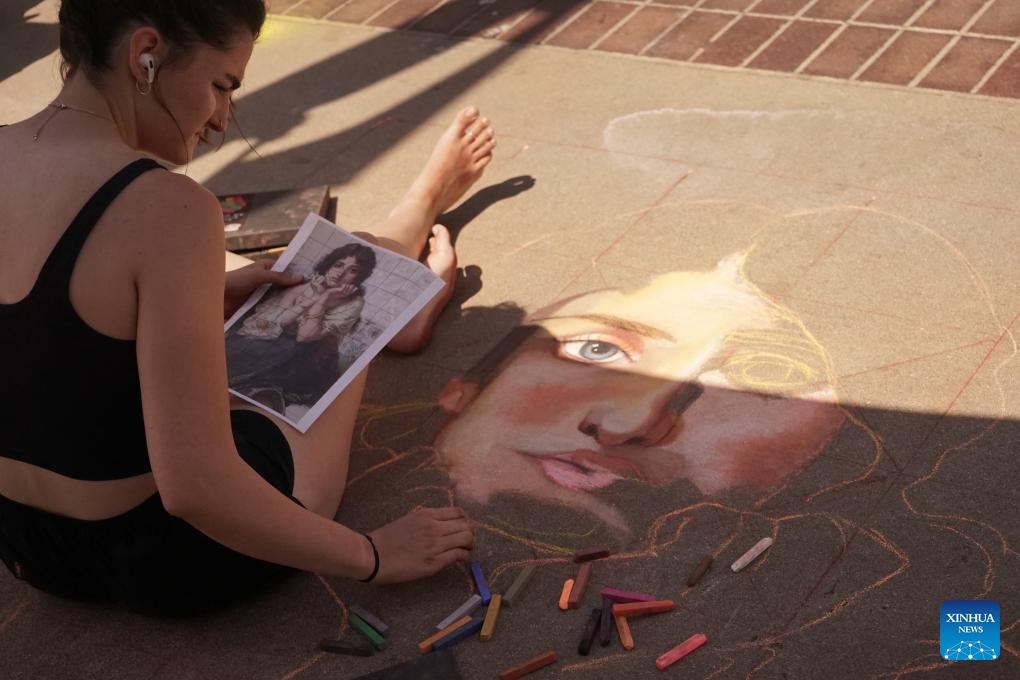 A chalk artist creates a work during the Pasadena Chalk Festival in Pasadena, California, the United States, June 14, 2025. More than 500 chalk artists participated in the two-day festival that kicked off here Saturday..(Photo: Xinhua)