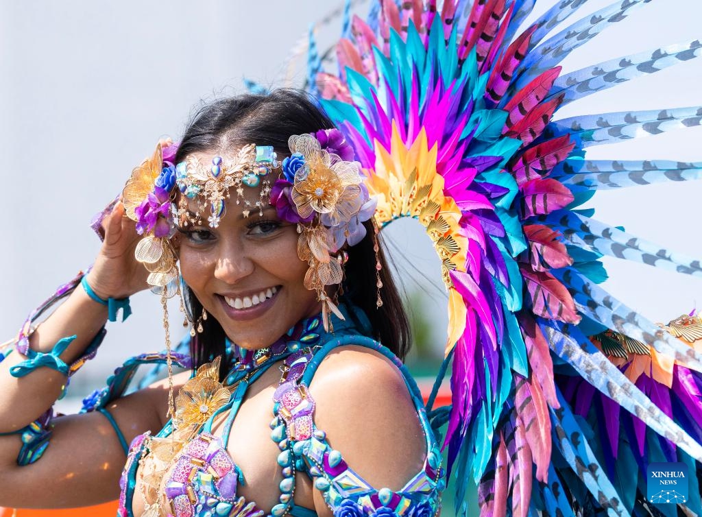 A dressed-up reveler poses for photos during the official launch ceremony of the 2025 Toronto Caribbean Carnival in Toronto, Canada, on June 14, 2025. (Photo: Xinhua)