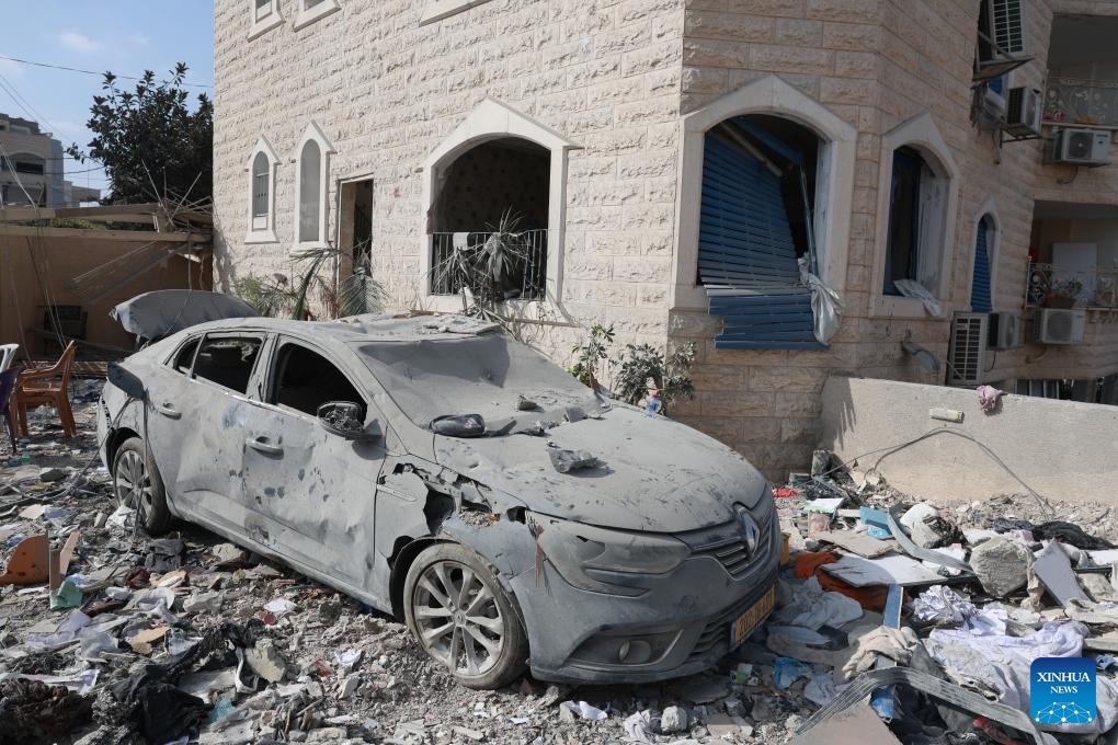 A vehicle damaged during Iranian missile strike is pictured in Tamra, Israel, June 15, 2025. The number of fatalities from a missile attack that hit Tamra, an Arab city in the North District of Israel, on Saturday night rose to four, according to the Magen David Adom (MDA) rescue service. They were identified as a mother and her two daughters and another relative. Dozens were injured. (Photo: Xinhua)
