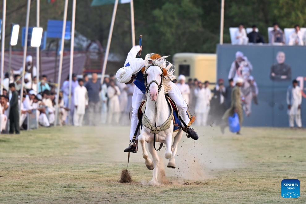 A horseman competes during a tent pegging competition in Islamabad, capital of Pakistan on June 14, 2025. In tent pegging, a horseman gallops and uses a sword or a lance to pierce, pick up and carry away a wooden peg. (Photo: Xinhua)