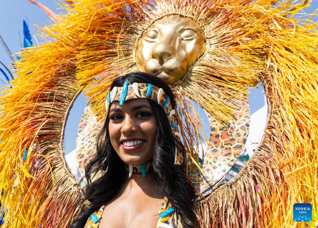 A dressed-up reveler poses for photos during the official launch ceremony of the 2025 Toronto Caribbean Carnival in Toronto, Canada, on June 14, 2025. (Photo: Xinhua)