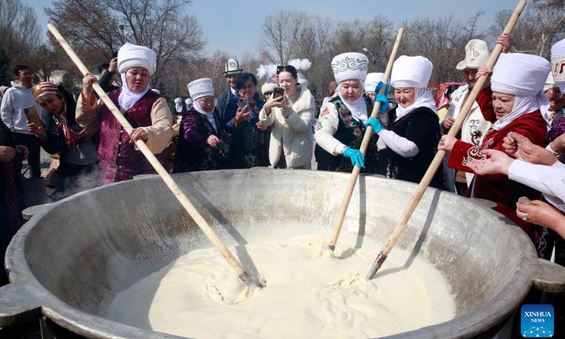 People prepare traditional food to celebrate the Nowruz festival in Bishkek, the capital of Kyrgyzstan, March 20, 2023. Regarded as the beginning of a New Year and one of the most important festivals in Central Asian countries, Nowruz marks the first day of spring. With fragrant baked naan bread, aromatic pilaf, rich and chewy horse sausage, sweet and juicy fruits and vegetables, and uniquely flavored dairy products, the cuisine of the five Central Asian countries embodies the traditional diet of nomadic peoples and the spice heritage of the Silk Road, showcasing the richness of intercultural culinary exchanges. (Photo: Xinhua)