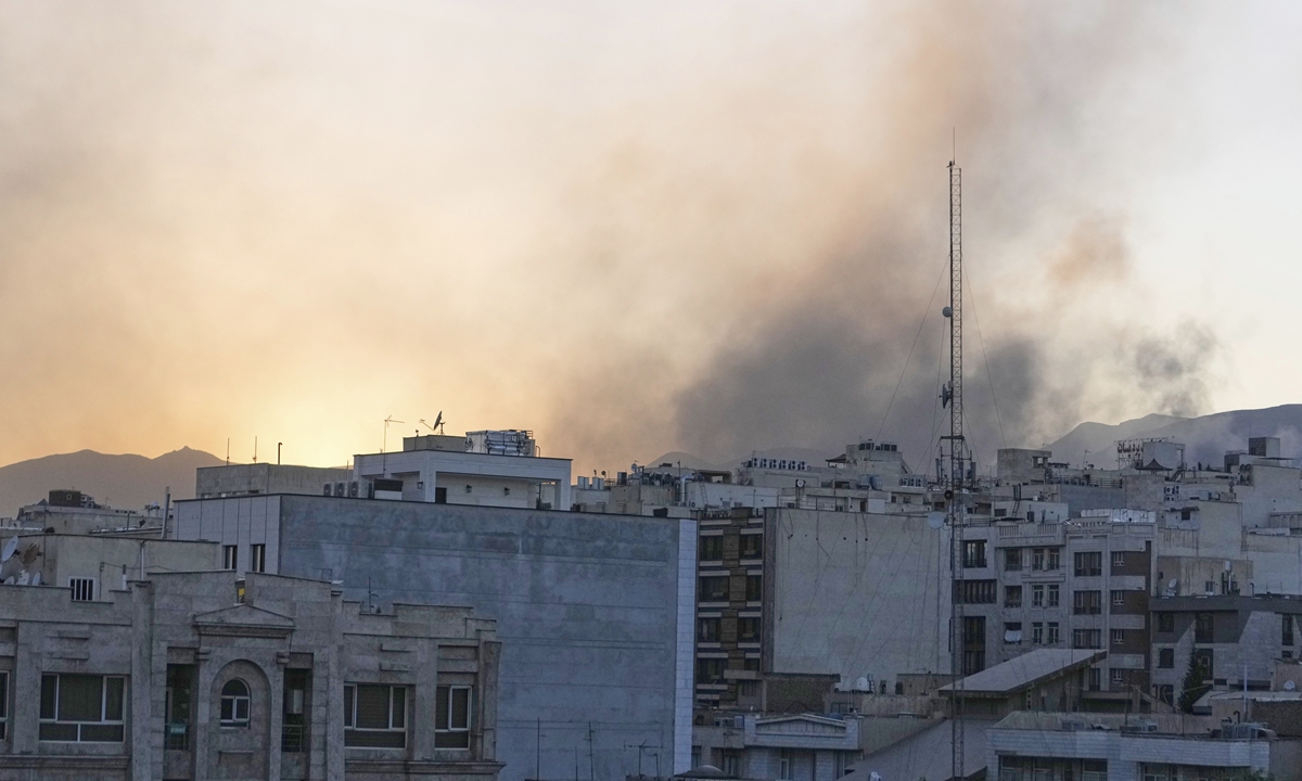 Smoke rises up after Israel's attack, in Tehran, Iran, Wednesday, June 18, 2025 Photo: VCG