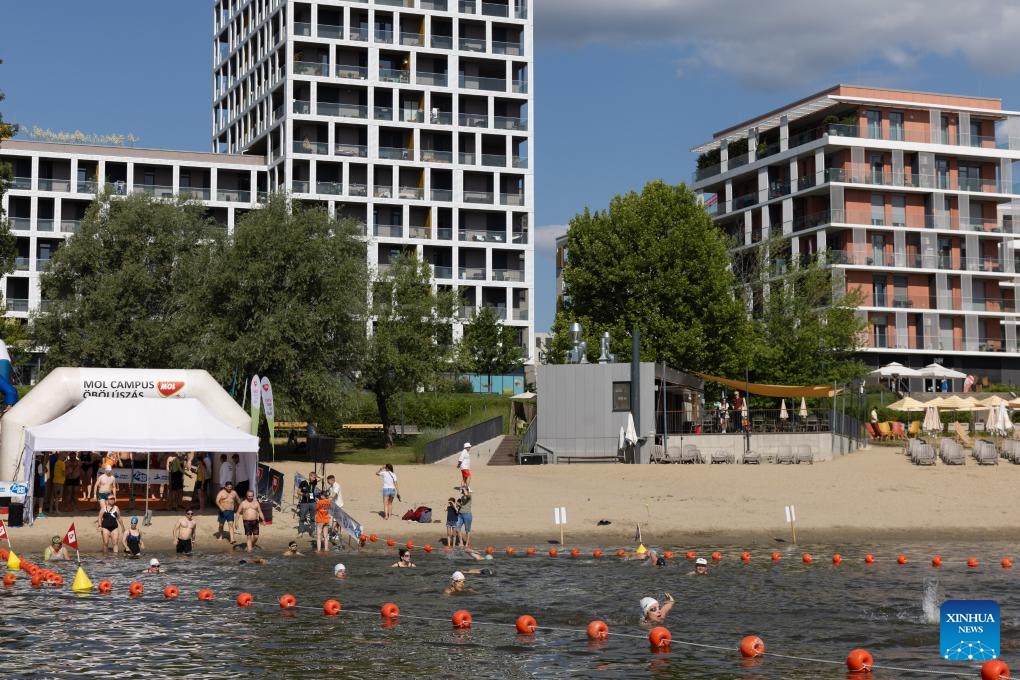 Participants swim across the bay at Buda Beach in Budapest, Hungary on June 21, 2025. (Photo: Xinhua)