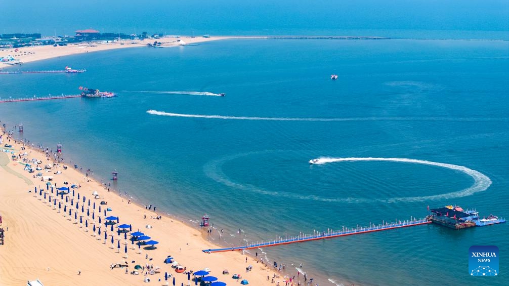 A drone photo taken on June 21, 2025 shows a seaside view in Binhai New Area of north China's Tianjin. In recent years, Binhai New Area in Tianjin has made great efforts to protect ecological environment and upgraded the layout of parks. Several seaside landmarks in Binhai have become popular tourist destinations. (Photo: Xinhua)