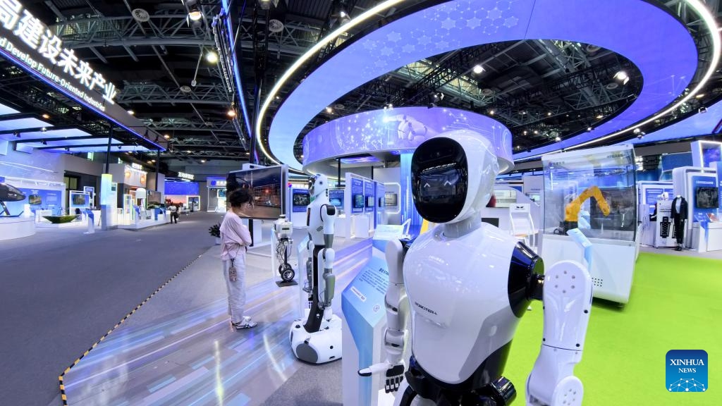 A visitor learns about humanoid robot products at the Zhongguancun Exhibition Center in Beijing, capital of China, June 20, 2025. (Photo: Xinhua)