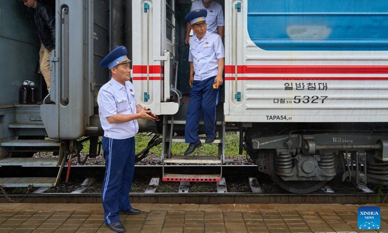 Staff members get off an international train from Pyongyang at the Khabarovsk Railway Station in Khabarovsk, Russia, June 21, 2025. The international passenger train service between Pyongyang, the capital of the Democratic People's Republic of Korea (DPRK), and Khabarovsk, a city in Russia's Far East, resumed operation after a five-year suspension. The first train following the restoration of the route arrived at Khabarovsk Railway Station on Saturday. (Photo: Xinhua)
