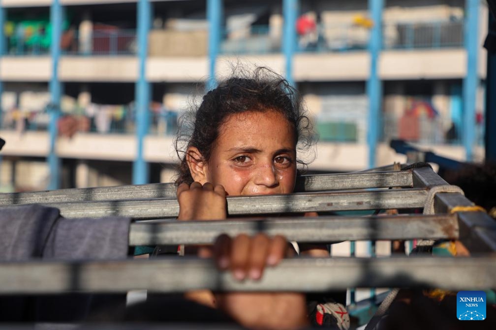 A displaced Palestinian child is seen inside a school-turned shelter in Gaza City, on June 20, 2025. (Photo: Xinhua)