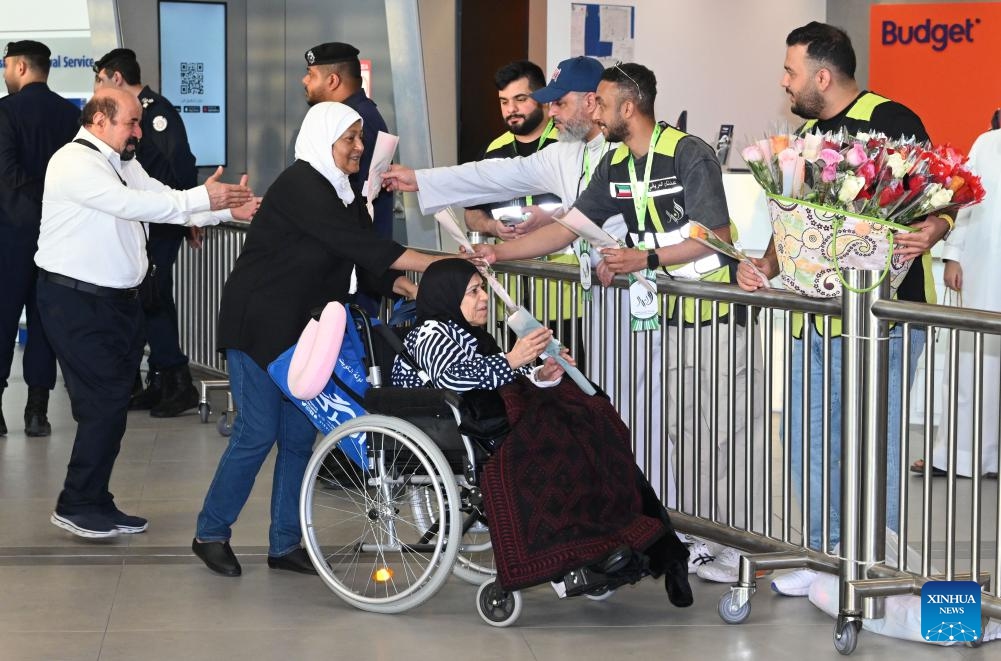 People evacuated from Iran are welcomed at Kuwait International Airport in Farwaniya Governorate, Kuwait, June 21, 2025. The first batch of Kuwaiti citizens evacuated from Iran via Turkmenistan arrived in Kuwait on Saturday morning, as part of the ongoing efforts made by the Kuwait's Ministry of Foreign Affairs. (Photo: Xinhua)