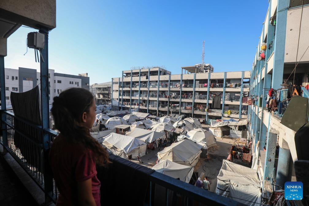 A displaced Palestinian child is seen inside a school-turned shelter in Gaza City, on June 20, 2025. (Photo: Xinhua)