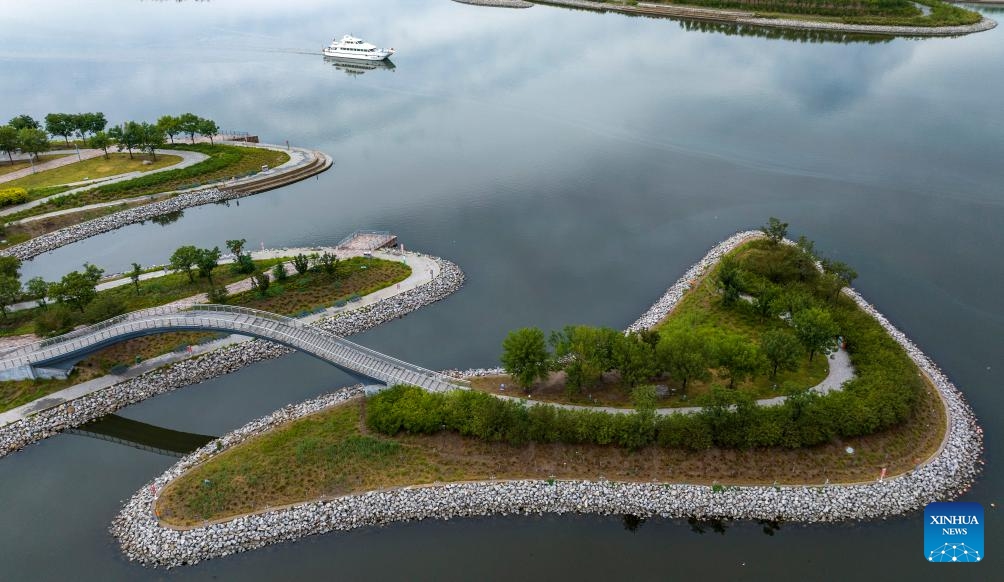 A drone photo taken on June 19, 2025 shows a view of a seaside park in Binhai New Area of north China's Tianjin. In recent years, Binhai New Area in Tianjin has made great efforts to protect ecological environment and upgraded the layout of parks. Several seaside landmarks in Binhai have become popular tourist destinations. (Photo: Xinhua)