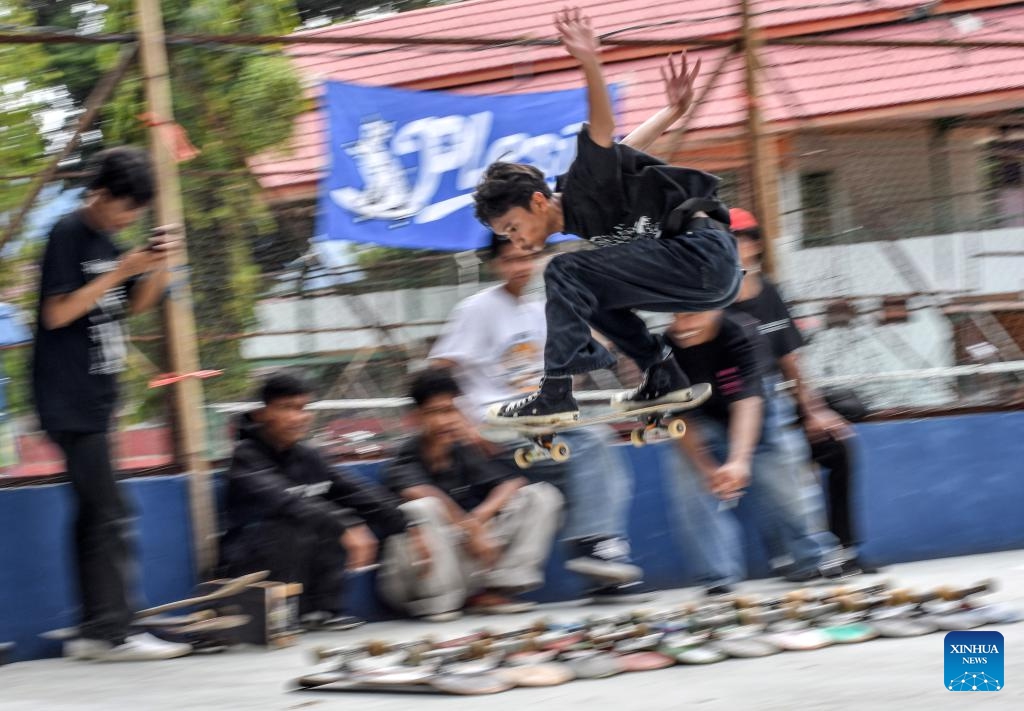 A boy performs a trick with his skateboard to celebrate the annual Go Skateboarding Day event in Palu, Central Sulawesi, Indonesia, on June 21, 2025. (Photo: Xinhua)