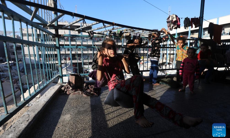 Displaced Palestinian children are seen inside a school-turned shelter in Gaza City, on June 20, 2025. (Photo: Xinhua)