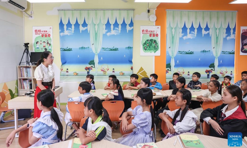 Students has a fairy tail reading class in the Experimental Primary School in Hanlin Town of Ding'an County, south China's Hainan Province, June 20, 2025. Teachers in the school organized role-playing activities and interactive discussions to generate students' enthusiasm for reading. (Photo: Xinhua)