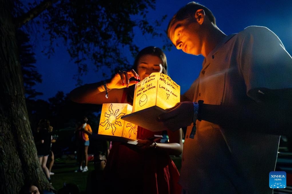 People attend the Water Lantern Festival in Pawtucket, Rhode Island, the United States, on June 21, 2025. (Photo: Xinhua)