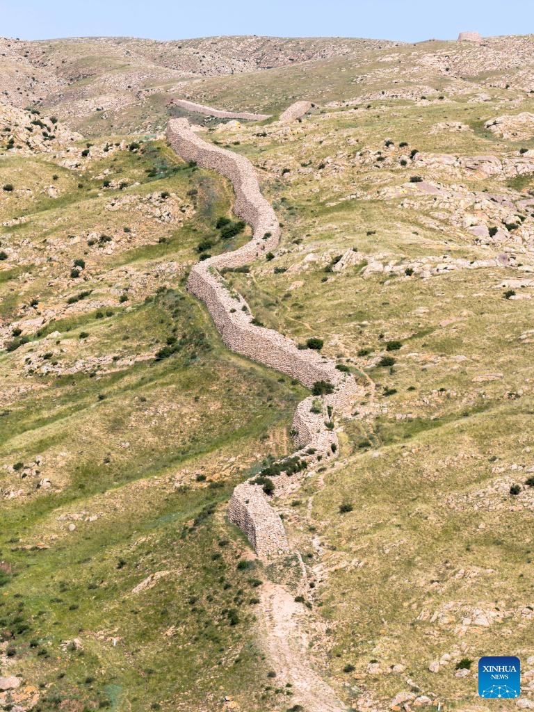 An aerial drone photo taken on June 21, 2025 shows the Tianshengcheng section of the Great Wall in Guyang County, north China's Inner Mongolia Autonomous Region. The Great Wall built in the Qin Dynasty (221 BC-207 BC) in Guyang County is well preserved due to its rock structure and the protection efforts made by local authorities. (Photo: Xinhua)