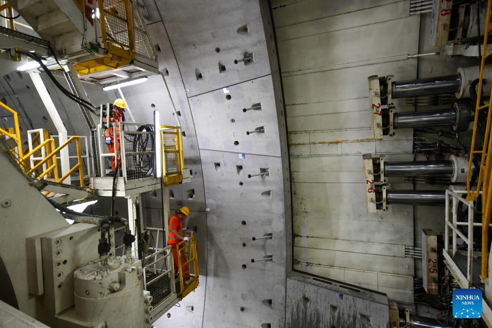 Staff workers work at the construction site of the Yellow River tunnel on Huanggang Road in Jinan, east China's Shandong Province, June 22, 2025. The excavation work of the Yellow River section of the Huanggang Road Yellow River tunnel was completed on Sunday, marking a breakthrough in the construction of the tunnel project. The 5,755-meter-long tunnel, with 3,290 meters excavated by a 17.5-meter diameter TBM, is the largest underwater TBM tunnel currently under construction in the world. (Photo: Xinhua)
