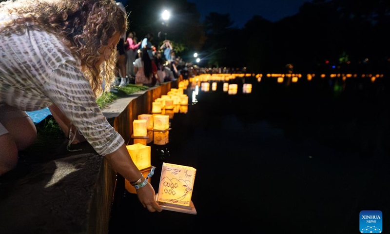 People release their water lanterns at the Water Lantern Festival in Pawtucket, Rhode Island, the United States, on June 21, 2025. (Photo: Xinhua)
