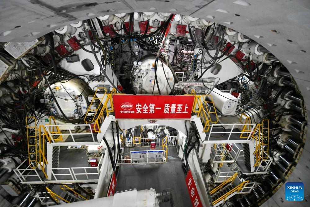 A tunnel boring machine (TBM) works at the construction site of the Yellow River tunnel on Huanggang Road in Jinan, east China's Shandong Province, June 22, 2025. The excavation work of the Yellow River section of the Huanggang Road Yellow River tunnel was completed on Sunday, marking a breakthrough in the construction of the tunnel project. The 5,755-meter-long tunnel, with 3,290 meters excavated by a 17.5-meter diameter TBM, is the largest underwater TBM tunnel currently under construction in the world. (Photo: Xinhua)