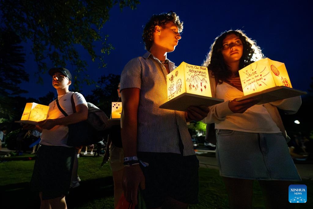 People attend the Water Lantern Festival in Pawtucket, Rhode Island, the United States, on June 21, 2025. (Photo: Xinhua)