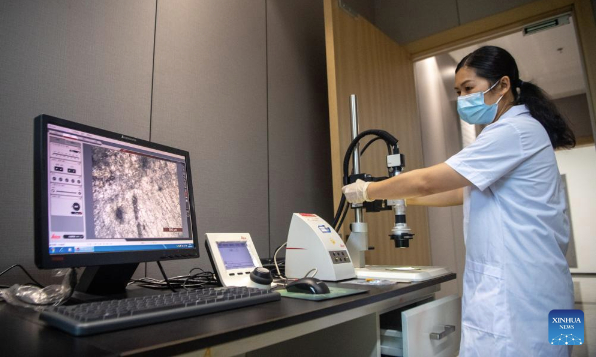 A staff member collects digital data from a rock-made relic at the Dazu Rock Carvings studio for relics restoration in southwest China's Chongqing Municipality, June 24, 2025. Dazu Rock Carvings, a UNESCO World Heritage Site in southwest China's Chongqing Municipality, is being injected with new vigor as various digital technologies are used for its protection and utilization.

Technologies of AI, cloud computing, and big data, among others, were also applied to create 8K dome theater movies, VR experiences and programs alike to better entertain the tourists. (Xinhua/Tang Yi)