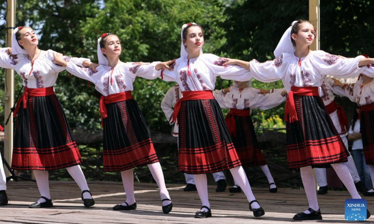 Girls dressed in traditional Romanian blouses perform during the Sanziene festival at the National Village Museum in Bucharest, Romania, June 24, 2025. According to traditions, fairies, called in Romanian Sanziene, descend to Earth around summer solstice to bring fertility to fields, love and good luck for the rest of the year. (Photo by Cristian Cristel/Xinhua)