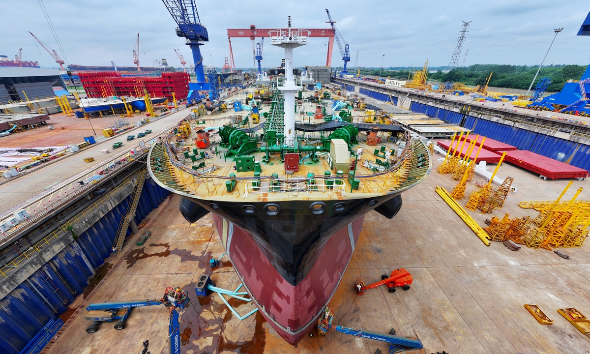 Workers at the Yangzhou COSCO Shipping Heavy Industry Co carry out construction work on a large ship in Yangzhou, East China's Jiangsu Province, on June 24, 2025. The company is aiming for a strong first half. Photo: VCG