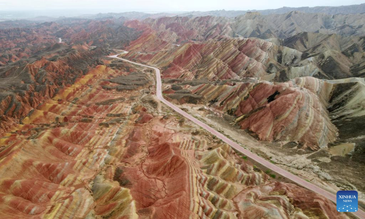 An aerial drone photo taken on June 22, 2025 shows a view of Danxia landform in the rain at the Danxia National Geological Park in Zhangye, northwest China's Gansu Province. (Xinhua/Chen Bin)