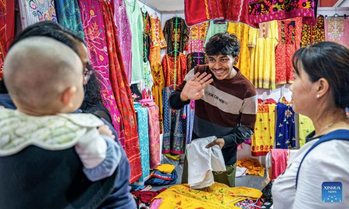 A Sri Lankan exhibitor greets visitors during the 9th China-South Asia Expo in Kunming, southwest China's Yunnan Province, June 24, 2025. The 9th China-South Asia Expo came to an end on Tuesday. A total of 153 agreements have been signed as of 12: 00 on June 24, with the total value of foreign trade contracts reaching 8.479 billion yuan (about 1.18 billion U.S. dollars). (Xinhua/Hu Chao)