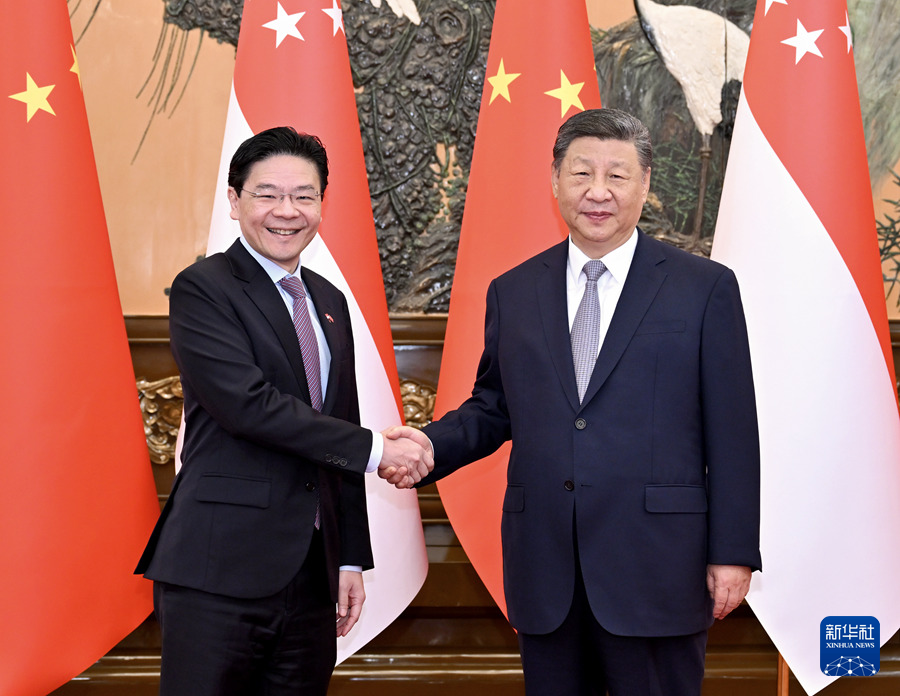 Chinese President Xi Jinping meets with Singaporean Prime Minister Lawrence Wong, who is on an official visit to China, at the Great Hall of the People in Beijing, capital of China, June 24, 2025. (Xinhua/Yue Yuewei)