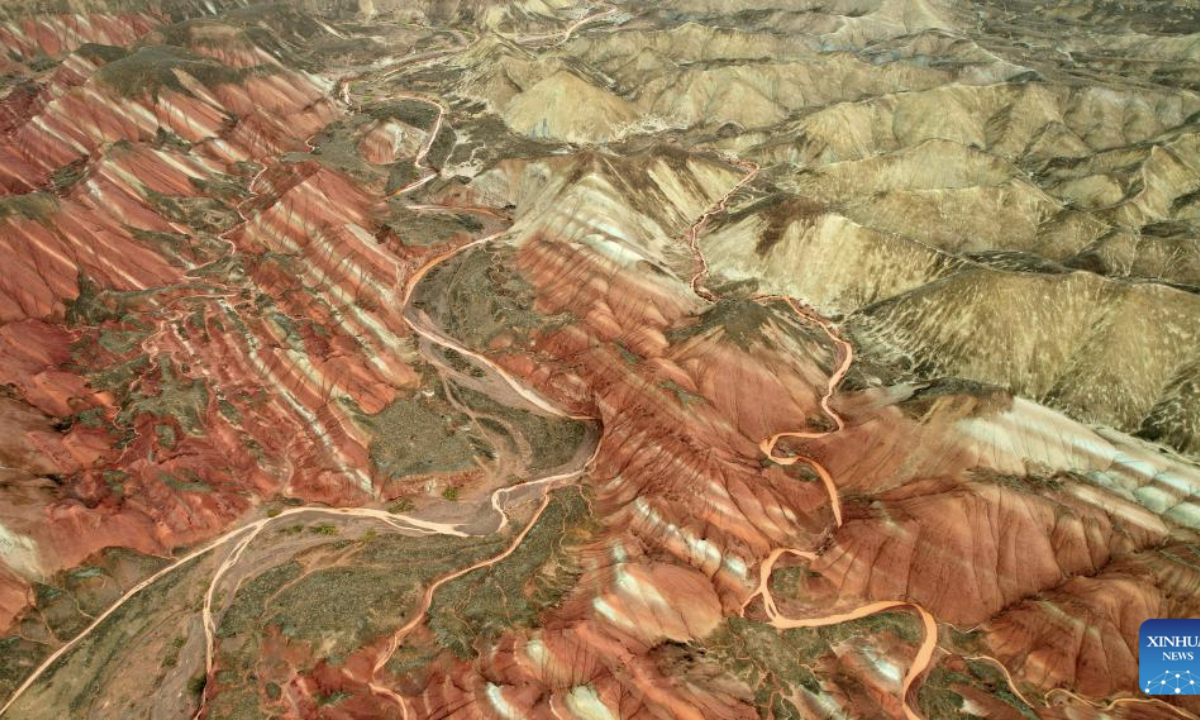 An aerial drone photo taken on June 22, 2025 shows a view of Danxia landform in the rain at the Danxia National Geological Park in Zhangye, northwest China's Gansu Province. (Xinhua/Chen Bin)