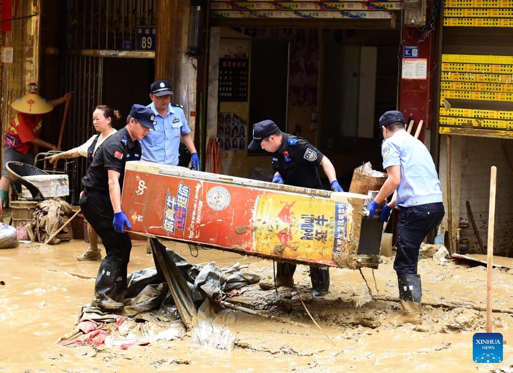 Rescuers conduct clearing and rescue work in Congjiang County, southwest China's Guizhou Province, June 25, 2025. Continuous heavy rainfall and upstream inflows have triggered severe flooding in two counties of Guizhou Province in southwest China, prompting mass evacuations. (Photo: Xinhua)