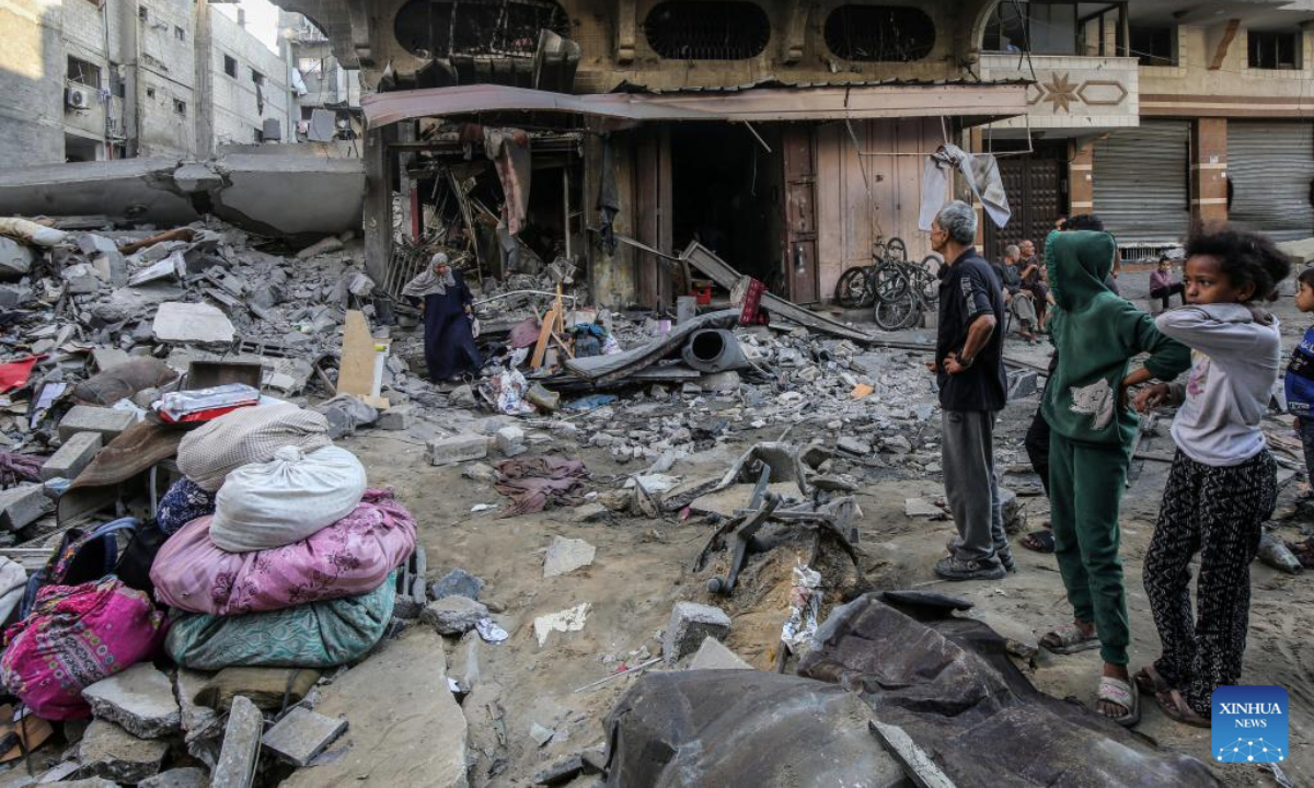 Palestinians gather at a site of an Israeli airstrike at the Shati refugee camp, west of Gaza City, on June 26, 2025. (Photo by Rizek Abdeljawad/Xinhua)