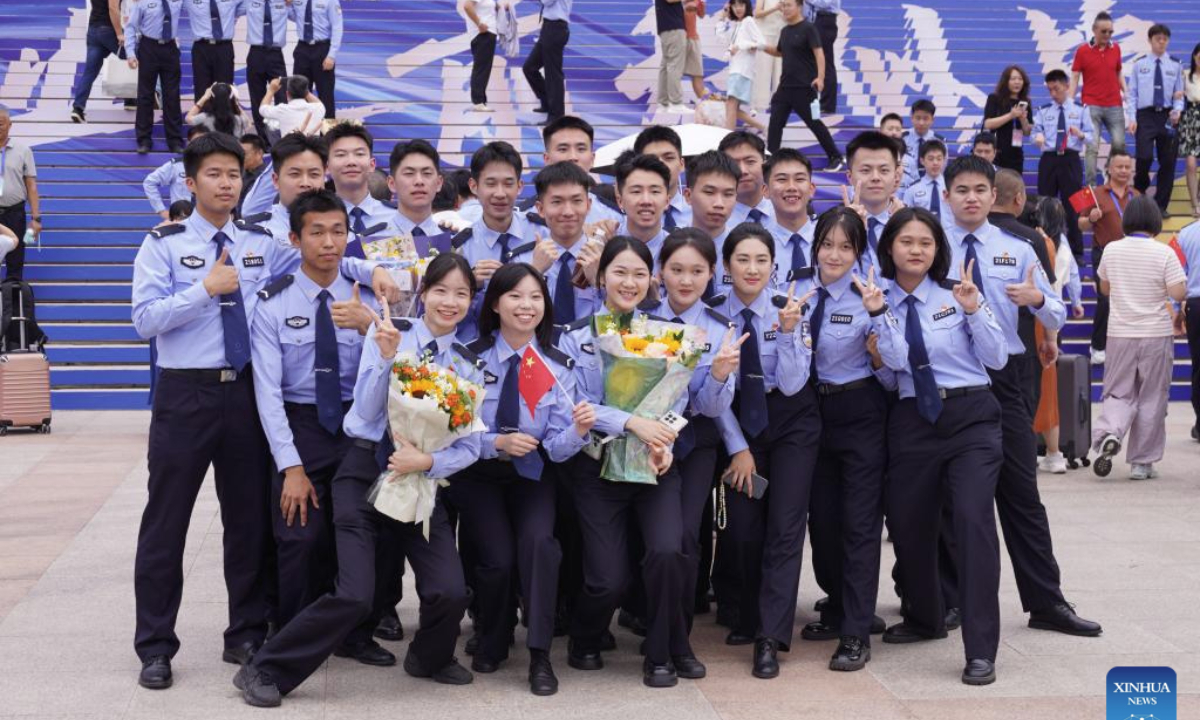 Graduates pose for a group photo after the graduation ceremony at People's Public Security University of China (PPSUC) in Beijing, capital of China, June 26, 2025. (Xinhua/Dai Mingxuan)