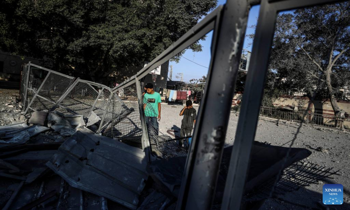 Palestinians inspect damage following an Israeli airstrike in Gaza City, on June 26, 2025. (Photo by Mahmoud Zaki/Xinhua)