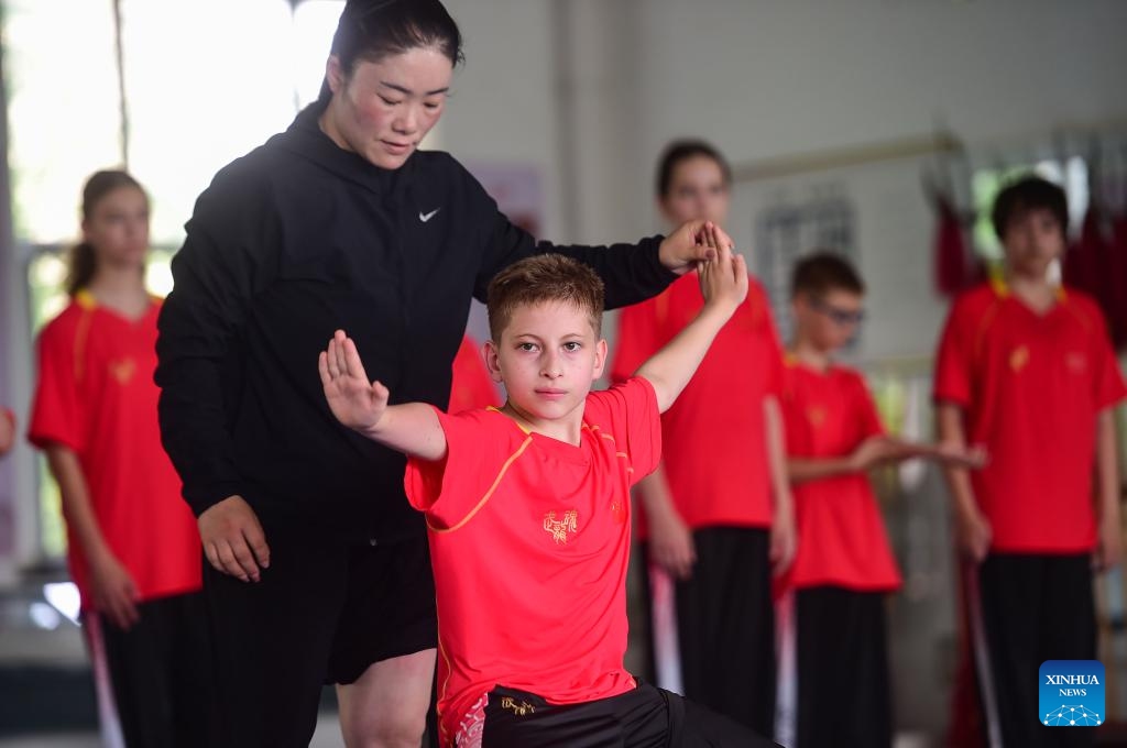A coach instructs a Russian student to practice Bajiquan, a powerful style of Kung Fu, at a training base in Qingxian County, Cangzhou City, north China's Hebei Province, June 25, 2025. A Bajiquan training base in Qingxian County welcomed this year's first batch of international students from Russia, who will learn the traditional Bajiquan and experience the Chinese martial arts culture. (Photo: Xinhua)